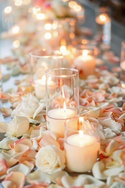 Candle centerpieces create a warm, inviting glow on wedding tables. Click for more inspiration. Fairy Lights Table Decor, Eucalyptus Candle Centerpiece, Beachy Centerpieces, Fairy Lights Table, Frosted Candle Holders, Romantic Centerpieces, Candlelit Wedding, Floating Candle Centerpieces, Minimalist Candles