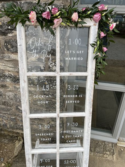 A simple garland of flowers decorated this rustic door sign French Doors Wedding, Farm Wedding Entrance, Door Wedding Entrance, Simple Garland, Garland Of Flowers, Order Of The Day Wedding, Farm Door, Window Signage, Wedding Doors