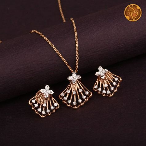 This 18kt Rose gold pendant Set is embellished with round brilliant diamonds.

Note: The given price is only for the pendant and Earrings, it does not include the Chain. Small Pendents Design, Small Pendent Set Diamond, Diamond Pendant Sets Unique, Pendent Set Gold, Diamond Pendent Set, Rose Gold Pendant Set, Jewellery Poster, Gold Pendant Set, Jewelry Necklace Simple