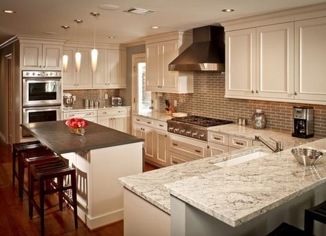 This kitchen has some unique aspects going on with the granite because the island is entirely different from the rest. That gray though really seems to emphasize the gray colors in the rest of the Bianco Romano granite. Slate Kitchen Countertops, River White Granite Countertops, Bianco Romano Granite, River White Granite, Slate Kitchen, White Kitchen Traditional, Slate Countertop, Kitchen Island Tops, White Granite Countertops