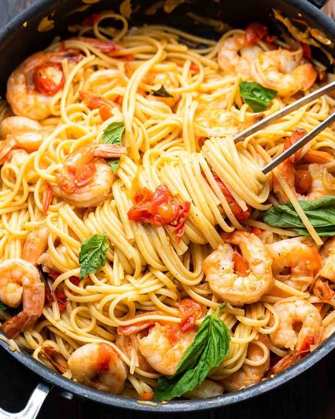 Shrimp tomato basil pasta combines plump shrimp with al dente linguine that's tossed in a garlicky cherry tomato shallot and chili sauce and finished with fresh hand-torn basil. This simple pasta can be ready in about 40 minutes and is perfect for busy weeknights! #shrimptomatopasta #shrimppasta #shrimprecipes Shrimp Tomato Pasta, Basil Pasta Recipes, Shrimp Tomato, Sip And Feast, Pasta With Shrimp, Fresh Tomato Pasta, Lemon Garlic Shrimp Pasta, Tomato Pasta Recipe, Garlic Shrimp Pasta