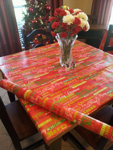 Use heavy duty wrapping paper as tablecloth.   Easy to clean up, quick to do, & cheap! Wrapping Paper Table Cloth, Preschool Christmas Party, Cheap Tablecloths, Table Island, Cloth Ideas, Christmas Party Table, Christmas Tablecloth, Paper Table, Party Table Cloth