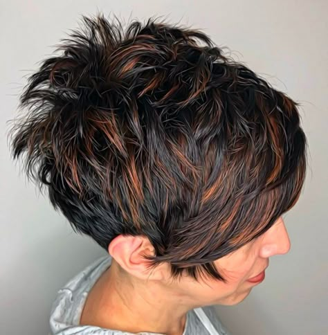 Layers are the pixie’s best friend and you can really take them to the next level by having them short enough to stick out at the crown! This gives the style some youthful freshness. Highlight a range of lengths in streaks choosing a delicious shade, like, for instance, cinnamon as an accent color for dark brown hair. Highlights For Short Dark Hair, Short Pixie With Highlights, Short Messy Hair Choppy Pixie Cuts, Short Pixie Haircuts For Thick Hair, Short And Sassy Hair, Under Cut Pixie, Assymetrical Hair, Pixie Cut With Highlights, Black Pixie