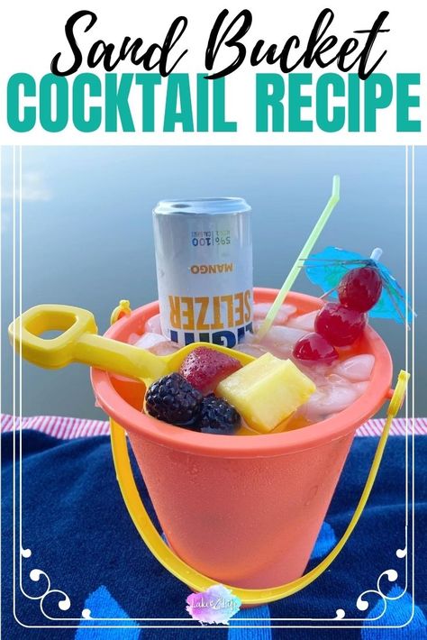 This Sand Bucket Cocktail Recipe is the perfect bucket cocktail drink for the summer. Enjoy your very own Beach Bucket Cocktail overflowing with rum, fruit juices, and hard seltzer. The absolute best bucket cocktail recipe out there! Booze Bucket Ideas, Sand Castle Bucket Drinks, Rum Bucket Drinks, Sand Bucket Cocktails, Drink Bucket Recipes, Rum Buckets Recipe, Beach Pail Alcohol Drink, Boozy Bucket Recipes, Sand Pail Alcohol Drinks