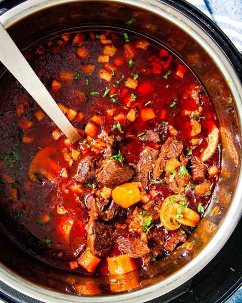 This Instant Pot Beef Bourguignon is my take on the classic from the late and great Julia Child. Made with hearty ingredients and a whole bottle of wine! #beefbourguignon #beefstew #instantpot #recipe Beefstew Instantpot, Instant Pot Beef Bourguignon, Cooking With Red Wine, Instant Pot Beef Stew Recipe, Instant Pot Stew, Pot Beef Stew, Hearty Stews, Cook Chicken Breast, Julia Child