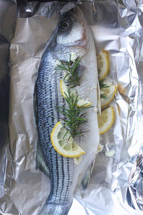 raw striped bass in foil before cooking Whole Striped Bass Recipe, Striped Bass Recipe Grilled, Striped Bass Recipe Baked, Whole Sea Bass Recipes, Striped Bass Recipe, Striper Fish, Baked Sea Bass, Whole Fish Recipes, Cook Skins