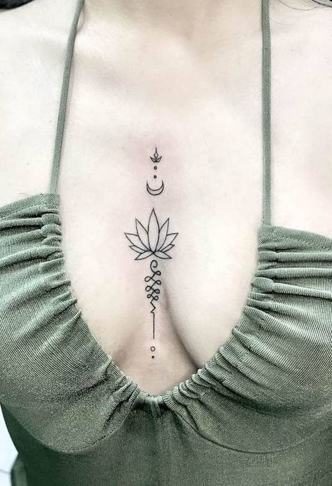 63 Soulful Lotus Tattoos with Meaning - Our Mindful Life Small Meaningful Tattoos For Women Chest, Lotus Flower Tattoo Under Breast, Lotus Flower Tattoo Between Breast, Middle Breast Tattoos For Women, Lotus Chest Tattoo, Lotus Flower Spine Tattoo, Cleavage Tattoos For Women, Tattoo In Between Chest Woman, Middle Of Chest Tattoo Female