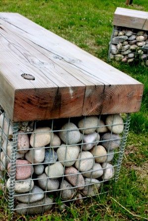 A gabion basket filled with pebbles and topped with a timber seat made from salvaged timbers from the old Weston-super-Mare Pier that was destroyed by fire. Gabion Bench, Rock Bench, Yard Seating, Gabion Garden, Stone Seating, Spa Steps, Swim Pond, Gabion Walls, Stone Fence