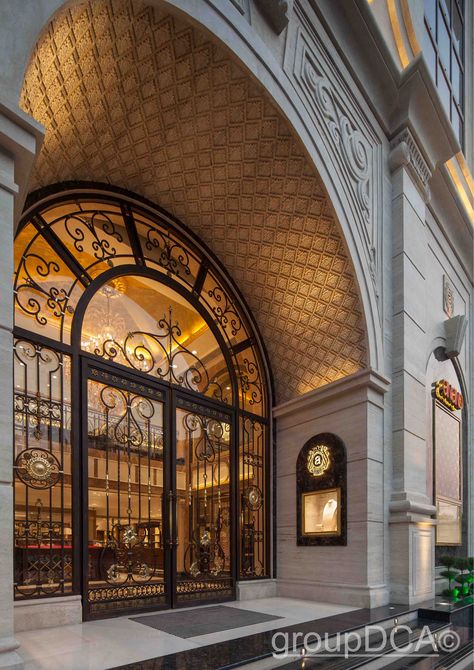 Anand Jewels : The facade of this luxury jewelry store is marked by the use of solid stone. its entrance is framed by an arch which features intricate carving on the underside. Jewelry Boutique Interior, Store Entrance Design, Interior Store Design, Store Entrance, Jewelry Store Interior, Luxury Jewelry Store, Shop Facade, Jewelry Store Design, Hotel Door