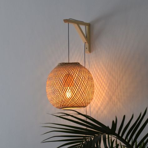 Please expand this item details section to read the full details and description. A traditionally handwoven Thai bamboo trap basket, re-purposed into a beautifully minimalistic wall bracket pendant light. [ About ] A classic example of Asian craftmanship, these fishing traps are handwoven from natural bamboo using techniques that are centuries old. We've modified an aspen bracket to create a beautiful wall mounted pendant, perfect for placing anywhere in the home. It is light enough to be stuck Bamboo Wall Light, Wall Mount Pendant Light, Hanging Lamp Decor, Bedside Hanging Lights Plug In, Boho Hanging Baskets, Asian Style Bedrooms Interior Design, Diy Bamboo Pendant Light, Neutral Bedroom Lighting, Wicker Wall Light