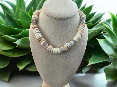 Surf Tumbled Cone Shell & Puka Shell Necklace 🐚 Crafted from ethically and lovingly collected Hawaiian shells in a mix of whites, creams, cinnamons, purples, & peaches. Available in my Of The Sea 🌊 Collection. • • #pukashells #pukashellnecklace #coneshell #shellsofhawaii #handmadejewelry Cone Shell, Puka Shell Necklace, Puka Shell, Necklace Craft, Shell Necklace, Shell Necklaces, Peaches, The Sea, Shells