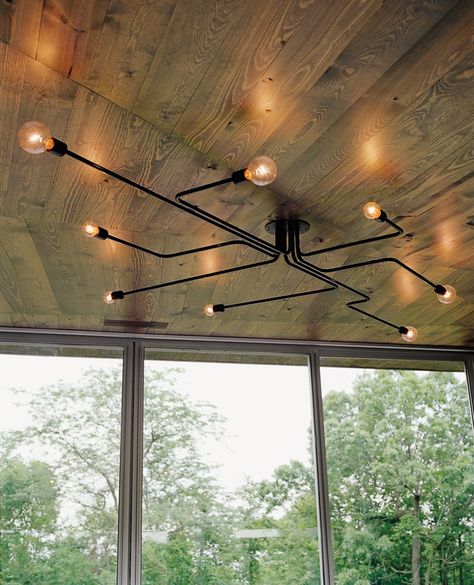 Sleek aluminum-clad house surrounded by forest Blitz Design, Diy Lampe, Lights Hanging, Pipe Lighting, Industrial Living, Industrial Livingroom, Vintage Pendant Lighting, Suspension Vintage, Deco Luminaire