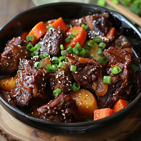 🥩 Experience the rich flavors of Galbi Jjim! 🍖✨ #BraisedShortRibs #KoreanDelight Galbi Jjim (Braised Beef Short Ribs) Ingredients: Beef short ribs (1 kg) Soy sauce (1/2 cup) Brown sugar (1/4 cup) Garlic, minced (4 cloves) Ginger, minced (1 tbsp) Carrot, sliced (1) Potato, diced (2) Onion, chopped (1) Water (2 cups) Sesame oil (1 tbsp) Sesame seeds (for garnish) Green onions, chopped (for garnish) Instructions: Combine soy sauce, brown sugar, garlic, and ginger in a pot. Add beef short rib... Galbi Jjim Aesthetic, Galbi Jjim, Twisted Recipes, Braised Short Ribs, Beef Short Ribs, Braised Beef, Trending Recipes, Food Babe, Birthday Food