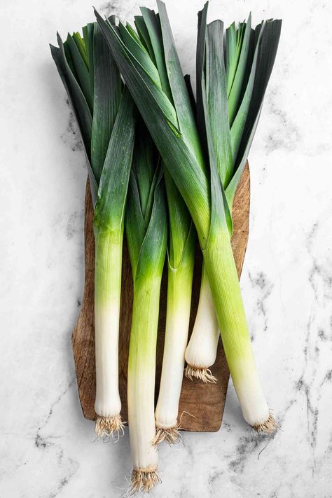 Leeks are from the onion family and are a workhorse in the kitchen. Learn how to choose, store, clean, prepare, and cook leeks at home. How To Clean Leeks, Leek Vegetable, Canning Water, Making Salad, Blueberry Pie Filling, Salad Spinner, Leek Soup, Favorite Pie, Healthy Lunches