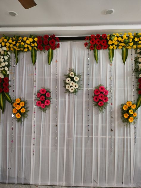 Engagement Decoration Simple At Home, Stage Decorations Simple Event, Background Flower Decoration For Pooja, Srimantham Decorations, Upanayanam Decoration, Normal Background, Door Flower Decoration, Stage Decoration Photos, Eco Friendly Ganpati Decoration