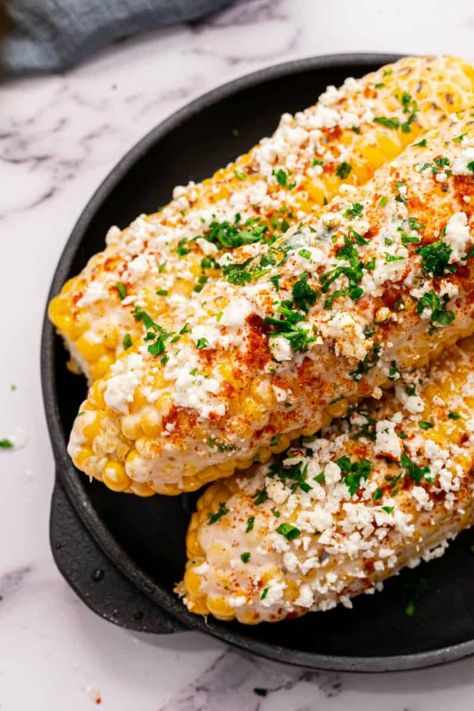 The Pioneer Woman Mexican Street Corn is a staple of the summer and you can make it yourself. Top char-grilled corn on the cob with a tangy, creamy sauce, sprinkle with crumbled cheese, and dig in. Perfect for a backyard barbecue! Elote Preparado, Mexican Corn Recipes, Elote Recipe, Mexican Street Corn Recipe, Street Corn Recipe, Tastes Better From Scratch, Mexican Snacks, Mexican Corn, Mexican Street Corn