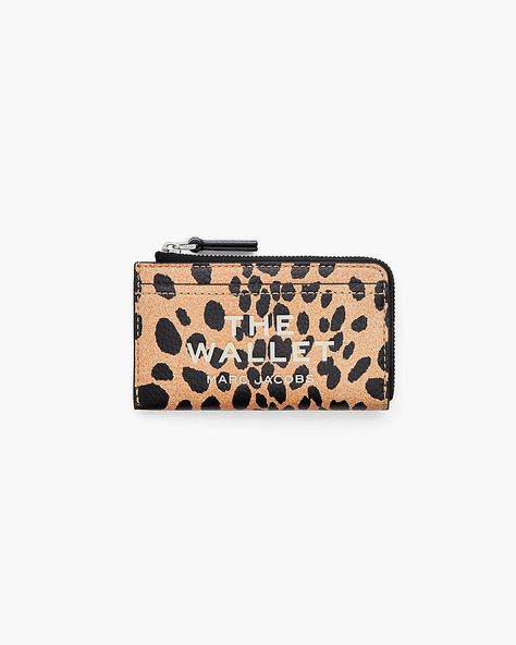 A beloved member of our iconic “The” collection, this covetable cheetah pebble leather wallet features our signature debossed namesake branding and a secure zip-around closure. A handbag essential, this compact, yet spacious wallet includes four card slots, two slip pockets and a dog clip chain for effortless key access. Shop Marc Jacobs The Cheetah Top Zip Multi Wallet Cheetah Top, Marc Jacobs Wallet, The Cheetah, Handbag Essentials, Dog Clip, Christmas Wishlist, Pebbled Leather, A Dog, Leather Wallet