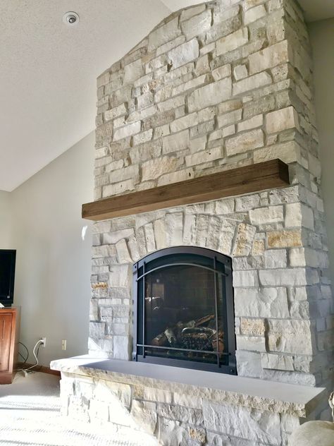 Stone Fireplace Mountain Home, Arch Stone Fireplace, Rustic Stone Fireplace Ideas, Farmhouse Rock Fireplace, Coastal Stone Fireplace, River Rock Fireplace Ideas, Stone Fireplace With Tv Above Mantle, Arched Stone Fireplace, Fireplace Makeover Stone