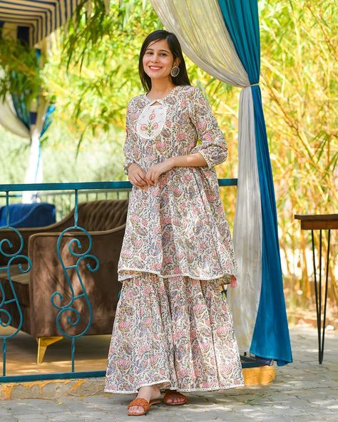 This 2 piece set includes Kurta and Sharara,Kurta - Cotton fabric,Sharara - Cotton fabric.Model (5'7") is wearing size S Sharara Designs Simple, Cotton Sharara Suits, Cotton Sharara, Kurta And Sharara, Sharara Designs, Trendy Outfits Indian, Kurta Cotton, Short Frock, Outfits Indian