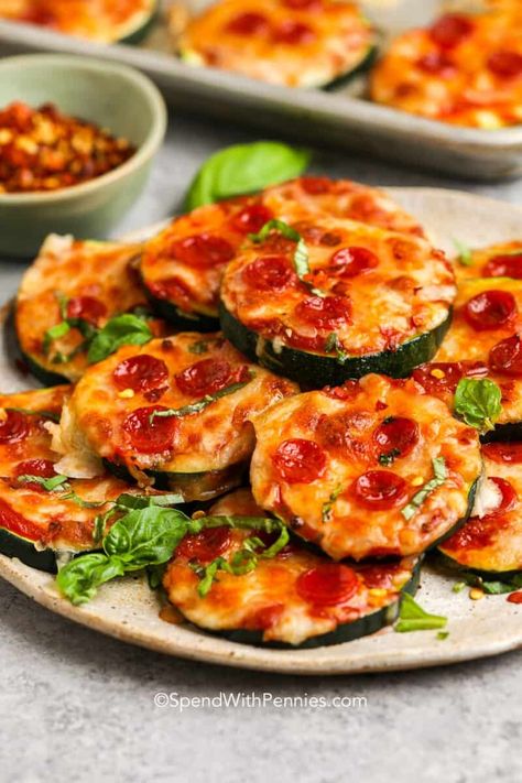 We love these zucchini pizza bites – a lighter, bite-sized pizza that is packed with flavor. Fresh zucchini rounds are the perfect base, topped with zesty pizza sauce, a blend of gooey cheeses, and your favorite toppings. It's an ideal treat for gatherings, snacking, or when that pizza craving strikes! #zucchinipizzabites #zucchini #pizza #spendwithpennies Noodles Dishes, Pizza Bites Recipe, Pizza Craving, Recipe For Zucchini, Zucchini Rounds, Zucchini Casserole Recipes, Zucchini Pizza Bites, Zucchini Bites, Easy Zucchini Recipes