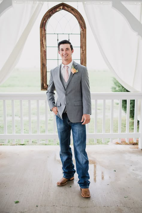 Groom wearing suit jacket and jeans with cowboy boots. Groom in gray suit jacket with boots.  Photo by: Rebecca Chesney Photo & Film Tux With Jeans And Boots, Gray Suit Jacket With Jeans Wedding, Suit Jackets And Jeans Wedding, Grey Jacket And Jeans Groom, Jeans And Sports Coat Wedding, Suit And Jeans For Men Wedding, Groom Outfit With Jeans, Country Groomsmen Attire Jeans, Grey Suit Jacket With Jeans Wedding