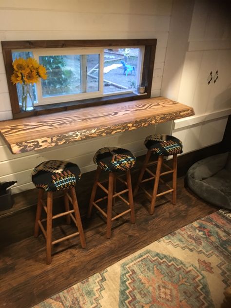 Tiny house table sitting area stools live edge Small Cabin Kitchen Table, Tiny House Kitchen Table Ideas, Bar Table In Camper, Rv Bar Table Ideas, Tiny Home Kitchen Table Ideas, Tiny House Table Ideas, Tiny Home Dining Area, Tiny Home Shed Ideas, Tiny House Table