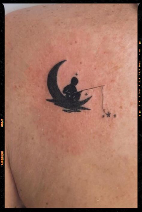 Pics edited by AirBrush App. Filter: Color +ult-3 • MOON TATTOO .#airbrush #retouch #photoeditor #filter #airbrushmakeup #airbrushart #airbrushfilter #inspiration #moon #moontattoo #minimalist Fishing On The Moon Tattoo, Man In The Moon Tattoo Designs, Disney Moon Tattoo, Small Moon Tattoo Men, Moon Man Tattoo, Sitting On The Moon Tattoo, Dreamworks Moon, Man On The Moon Tattoo, Man In The Moon Tattoo