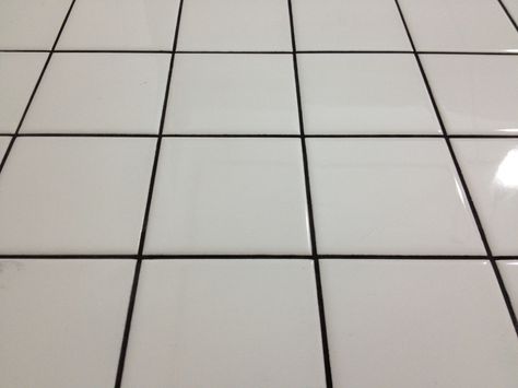 white floor tile with black grout just looks bad. Black Tile Grout, White Tiles Grey Grout, White Tiles Black Grout, Blue Tile Floor, Floor Tile Grout, Black Tile Bathrooms, White Mosaic Tiles, Tile Floor Living Room, Black Grout