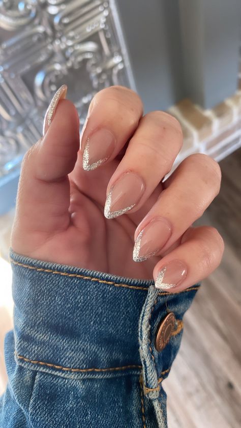 Sliver Glitter Nail Designs, Glitter V Tip Nails, White Sparkle Nails Glitter French Tips, French Tip Silver Nails, White Nails With Silver Glitter Tips, Silver Prom Nails Almond, Silver New Years Nails, Glitter Nails Almond Shape, Elegant Glitter Nails