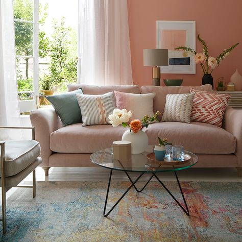 This earthy, faded-terracotta tone will give your living room a natural glow. We recommend trying this colour if your furniture is simple and modern. Peach Living Rooms, Pink Sofa Living Room, Coral Living Rooms, Blush Pink Living Room, Pink Living Room Decor, Tan Sofa, Living Room Decor Inspiration, Pink Sofa, Eclectic Furniture