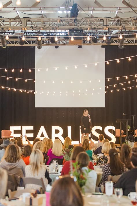 woman speaks on stage with FEARLESS sign behind her | Tennessee Women Connect Live Event at the Loveless Barn photographed by Nashville TN branding photographer Amy Allmand Photography. #AmyAllmandPhotography #TennesseeWomenConnect #NetworkingEvent Women Events Ideas, Women In Leadership Photography, Speak On Stage, Woman On Stage Speaking, Leadership Aesthetic Photography, Women Speaking On Stage, Woman Evolve Conference, Female Speaker On Stage, Speaking Engagement Aesthetic