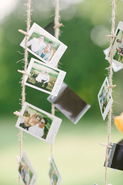 Hanging Photos Party Decor, Pictures Hanging From Trees, Photos Hanging From Tree, Hanging Pictures On The Wall With String, Hanging Pictures On String, Hanging Polaroids, Photo Clothesline, Family Wedding Pictures, Hanging Pictures On The Wall