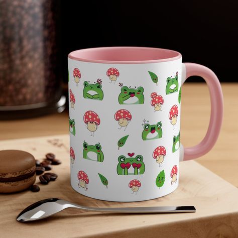 Sip your way to smiles with our adorable frog mugs! These mugs are the perfect companion for your morning coffee or tea. Each mug features a charming frog design that will make you leap with joy. Get ready to start your day with a splash of cuteness and a whole lot of froggy fun! 🌟💚🐸 #FrogMug #CuteMugs #RibbitingMug #FroggyFriends #MorningSips #Kawaii #FrogLover #FrogLife #FunMugs #CoffeeWithFrogs #TeaTimeFrog Game Corner, Mushroom Cup, Frog Mug, Ideas For Painting, Frog Life, Cute Mushroom, Frog Design, Cute Mugs, Pottery Painting