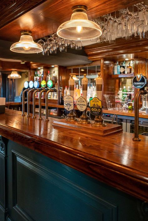 Glossy wooden bar with glasses hung above and with a variety of beers on draught. Bar And Pub Design, Australian Pub Interior, English Pub Home Bar, Pub Interior Ideas Modern, Irish Bar Design, Pub Lighting Ideas, Pub Astethic, Traditional Pub Interior, Pub Bar Ideas