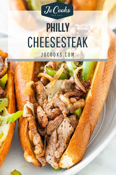 A classic Philly Cheesesteak sandwich made easy, in under 30 minutes! Hosting thinly sliced steak, and loads of ooey-gooey melted provolone. #phillycheesesteak #recipe Philly Cheesesteak Recipe, Philly Cheese Steak Sandwich, Philly Cheesesteaks, Yummy Sandwiches, Steak Sandwich Recipes, Football Appetizers, Philly Cheese Steak Recipe, Steak Sandwiches, Cheesesteak Recipe