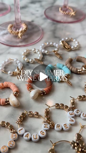 Erin Rae │ Hosting, Events, Dinner Parties, DIYs on Instagram: "This is your sign to make wine glass charms this summer!! 🍷☀️

Save this reel for later! ⬇️

I had left over beads from the coastal hat activity and wanted to make charms for all my glassware this summer. 

They are so easy to make and there are many different themes you can do with them. I bought the 60 pack of Wine Glass Charm Rings.

My favorite charm set is the coastal and summer vibes themed charms. 🐚☀️

These would make great gifts for birthdays, hosts, bachelorette parties or for new home owners. 

Follow @revexrae for more DIYs and hosting inspo 🤍

#wine #winecharms #diycrafts #giftideas #summertime #summerproject #dream #amazonfinds" Wine Glass Name Tags Diy, Crafts For Bachelorette Party, Bachelorette Dinner Themes, Bridal Shower Activities Crafts, Diy Wine Glass Charms, Diy Wine Charms, Wine Glass Charms Diy, Wine Glass Decorating Ideas, Wine Charms Diy