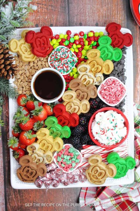 Start your day the Disney way with an awesome Mickey Waffle Charcuterie Board! It's loaded with festive Mickey Mouse-shaped waffles and lots of delicious toppings. It is so easy to put together - the whole family will love it for Christmas breakfast or brunch! Christmas Mickey Mouse Party, Disney Christmas Dinner, Christmas Charcuterie Breakfast Board, Breakfast Table Christmas Decor, Breakfast Friendsgiving, Christmas Breakfast Board Ideas, Disney Brunch Ideas, Christmas Morning Breakfast Board, Disney Christmas Food