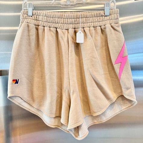 Brand New With Tags. In Original Packaging. Never Worn . Zero Flaws Authentic Aviator Nation Women’s Bolt Stitch Lounger Shorts In Sand / Neon Pink Av Logo Embroidered On Front Left Bottom Of Shorts. Side Bolt Stitched In Bright Pink. Handmade In Los Angeles Size Xl Price Is Firm. Use Code “ Kelsidcloset ” To Save $10 Off Your 1st Poshmark Order Bundle Multiple Items To Save On Shipping Same Day Shipping Top Rated Seller & Poshmark Level 2 Ambassador Shop More Closeouts At Kelsid.Com Aviator Nation Shorts, Av Logo, Purple Aviator Nation, Aviator Nation Sweatpants Pink, Aviator Nation Neon Pink Logo Sweatshirt, Aviator Nation Sweatshirt Pink, Aviator Nation, Aviators Women, Top Rated