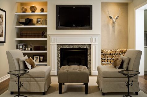 Interesting room - shelved recessed on both sides - one side displays books & accessories - the other an animal head and firewood! Comfortable looking and well done. Bookshelves Around Fireplace, Salons Cottage, Crown Wallpaper, Tv Over Fireplace, Toronto Interior Design, Modern Rustic Living Room, Fireplace Shelves, Cottage Living Rooms, Corner Fireplace