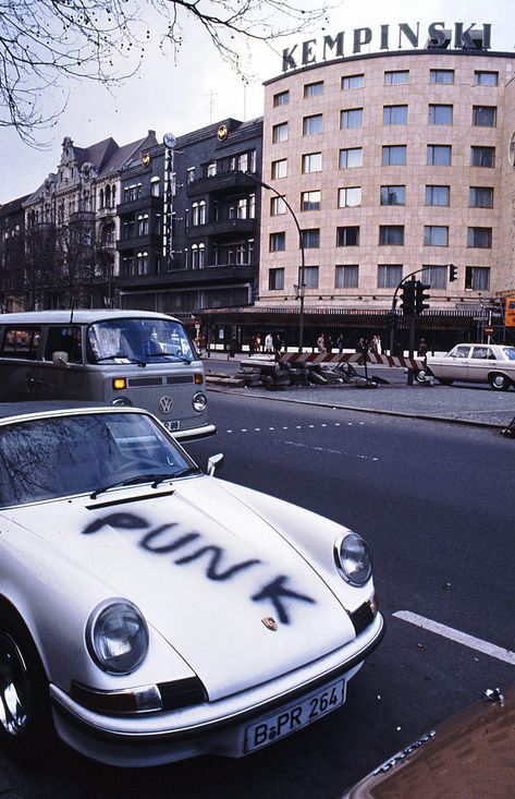 A Punk Porsche Opposite the Kempinksi Hotel in Berlin in the 80's and shot by Kurt Tauber. Not sure if this is the drivers own artwork but it is actually quite a good paint job in terms of the font and the spray work.⁠ ⁠ #porsche #punkporsche #berlin #punkberlin #kurttauber 1980s Aesthetic, Punk 80s, West East, West Berlin, Badass Aesthetic, 80s Aesthetic, The Secret History, Car Ride, Cool Paintings