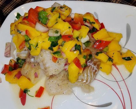 BROILED HADDOCK WITH FRESH MANGO SALSA Mango Cod Fish Recipes, Broiled Haddock, Mango Pineapple Salsa, Baked Haddock, Haddock Recipes, Oven Meals, Fresh Mango Salsa, Cod Fish Recipes, Mango Salsa Recipes