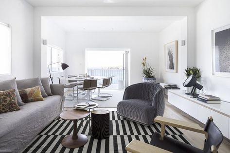 The oceanside setting was a primary influence on the interior colour palette and overall aesthetic of this Sydney apartment. Dulux White Paint, Dulux White, Rug Black And White, Monochromatic Room, Ikea Rug, Rug Black, Beautiful Apartments, Living Room Grey, Striped Rug