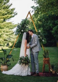 Wedding ceremony decor ideas - backyard boho bohemian arch triangle gold greenery snake plant {Haley Draper} www.mccormick-weddings.com Snake Plant Wedding Decor, Wedding Ceremony Decor Ideas, Ceremony Decor Ideas, Gold Wedding Ceremony, Ceremony Arch Decor, Backyard Boho, Green Gold Weddings, Elgin Illinois, Wedding Ceremony Decor