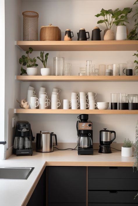 Enjoy a clutter-free coffee corner with a white countertop, walls, and light wood open shelves. A compact espresso machine, white mug, and potted plant create a cozy nook, while the shelves display cups, saucers, and a coffee bean jar. Indulge in simplicity with this clean design. Coffee Tea Station Open Shelves, Open Shelves Coffee Station, Free Floating Shelves In Kitchen, Shelves Above Coffee Station, Coffee Bar Mug Display, Floating Shelves Coffee Bar, Mug Display Shelf, Wood Open Shelves, Pub Interior Ideas