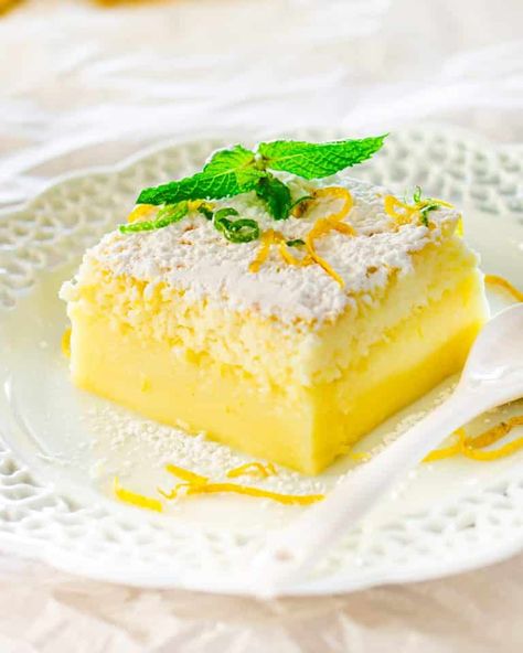 Lemon Magic Cake - one simple batter that turns into a 3 layer cake. Simply magical. The popular magic cake now in lemon flavor. #magiccake #lemonmagiccake #recipe Lemon Magic Cake Recipe, Lemon Magic, Magic Cake Recipes, Jo Cooks, Torte Cupcake, Lemon Cake Recipe, Magic Cake, A Piece Of Cake, Lemon Desserts