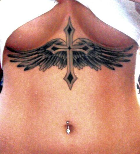 Cross & Wings Tattoo Woman Chest Tattoo Design, Cross On Stomach Tattoo, Cross On Chest Tattoo Woman, Cross With Wings Tattoo For Women, Cross Between Chest Tattoo, Wings Sternum Tattoo, Cross Sternum Tattoo Women, Cross Sternum Tattoo, Cross With Wings Tattoo Designs