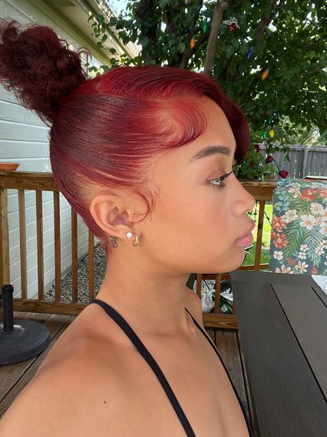 Red Natural Hairstyles Black Women, Red Bun Black Women, Red Hair Slick Back, Two Buns Hairstyle With Bangs, Heart Bun Black Women, Red Frontal Updo, Slick Bun With Bangs, Ginger Slick Back Bun, Bun With Side Bangs