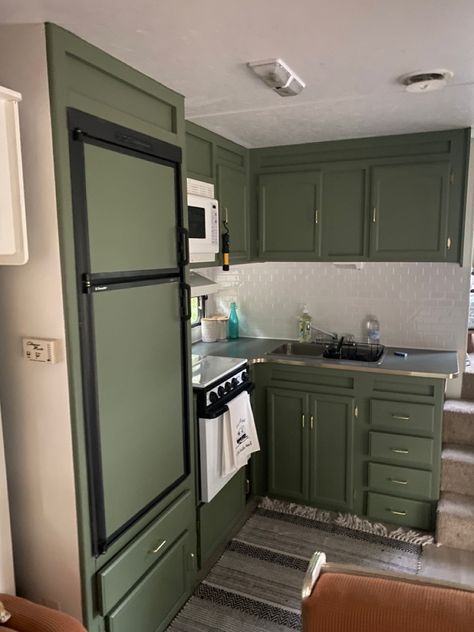 Trailer kitchen remodel with green cupboards Dark Green Camper Cabinets, Rv Remodel Green Cabinets, Rv Decorating Ideas Green, Green Cabinets Camper, Green Rv Kitchen, Green Rv Cabinets, Dark Green Camper Interior, Green Rv Interior, Green Camper Cabinets