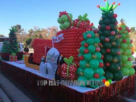 Elf Christmas Float Ideas, Balloon Christmas Parade Float, Christmas Wagon Decor For Parade, Radio Flyer Christmas Float, Rocking Around The Christmas Tree Float, Christmas Parade Floats Diy, Christmas Float Ideas Parade, Grinch Christmas Float, Grinch Float Parade Ideas