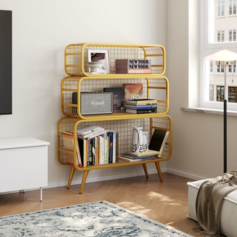 This modern golden style meshes standing etagere bookshelf with an original design defined by steel branches into any room in the house. The contrast between the top's broad lines and the structure's longitudinal threads creates an extra visual impression. It may be used as a bedside table as well as a set of floating shelves. The open display mesh standing etagere bookshelf provides storage, attractiveness, and elegance. The framed photographs, office supplies, or other ornamental knick-knacks